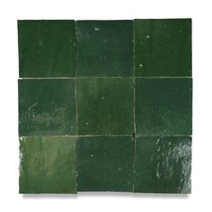 green tiles are arranged in the shape of squares