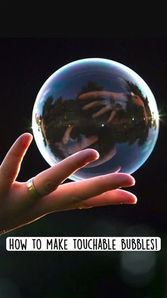 someone holding up a crystal ball with the words how to make touchable bubbles