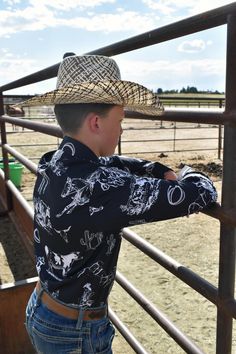 Our custom designed arena shirts are absolutely stunning and you won't find them anywhere else! Boast some serious style in this Unisex Western Button Up Shirt . Be rodeo-ready! Made from 100% polyester, lightweight and comfortable. Fabric has a slight sheen. This classic shirt provides a button-up style with long sleeves and chest pocket. Two buttons are included on each sleeve cuff to adjust a comfortable fit. PLEASE ALLOW UP TO 14 BUSINESS DAYS TO RECEIVE YOUR ORDER. Please calculate your siz Black Western-style Shirt For Western-themed Events, Western Black Shirt For Ranch, Western Style Black Shirt For Ranch, Mens Western Wear, Rodeo Fashion, Ranch Life, Western Boho, Plus Size Shopping, Classic Shirt