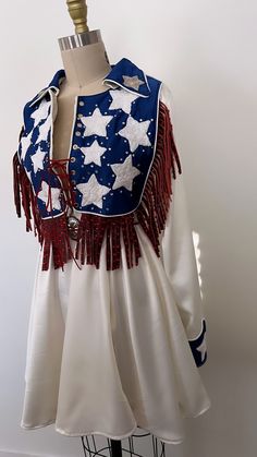 Made to order Americana swing dress with hand cut leather fringe & hand sewn embroidery. Dress is completely handmade from skirt to rhinestone placement! Each star is hand sewn! Dress has a hidden zipper on the side seam and corset closure in the chest. Comes with leather Concho belt to that ties in the back.   made to order measurements:   bust  waist hips armpit to wrist wrist hem (shoulder at neck straight down to below or above the knee) Corset Dress Western, Dixie Chicks Costume, Rhinestone Cowgirl Outfits, Cowboy Formal, Rodeo Costume, 70s Western Fashion, Vintage Western Outfits, Rodeo Queen Outfits, Hand Sewn Dress