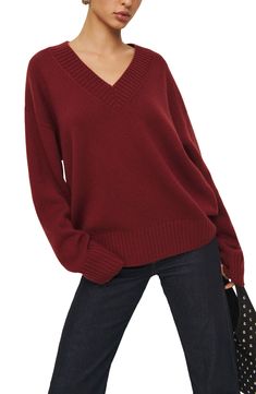 A blend of recycled cashmere and virgin cashmere adds a luxuriously soft feel to this oversized, layerable V-neck sweater trimmed with cozy ribbing. 24 1/2" length V-neck Long sleeves Ribbed cuffs and hem 95% recycled cashmere, 5% cashmere Dry clean Imported Burgundy V Neck Sweater Outfit, V Neck Sweater Outfit, Neck Sweater Outfit, Fall Winter Fashion Trends, Recycled Cashmere, Favorite Daughter, Burgundy Sweater, Loungewear Shorts, Oversized Silhouette