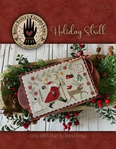 a cross stitch christmas stocking with holly wreaths on it and the words, holiday stuff