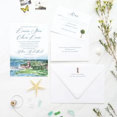 the wedding stationery is laid out on top of each other, including an envelope