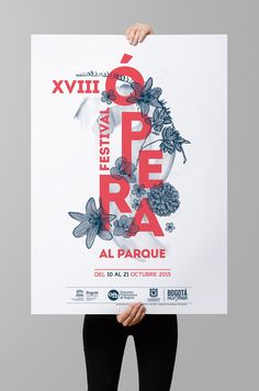 a woman holding up a poster with the words festival de la paque on it