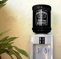 an old fashioned water dispenser is displayed on the wall