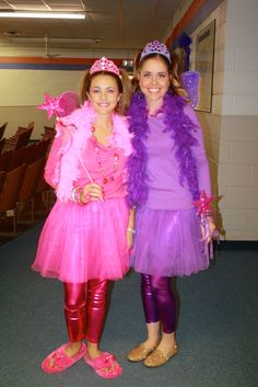 two women dressed in costumes standing next to each other