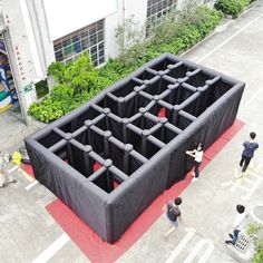 an inflatable structure is set up on the ground for people to walk around