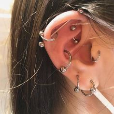 a woman with ear piercings on her ears