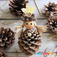 pine cones are used as decorations for the christmas tree and to decorate them with little angel figurines