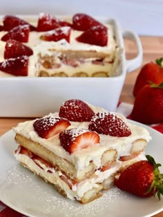 two pieces of cake with strawberries on top