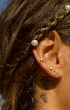 a woman with some piercings on her ear