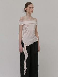 This product is an off-shoulder t-shirt that combines elegance with a casual edge. Featuring a frilled hemline that adds a touch of playfulness, this top provides a stylish option for those who appreciate modern design with a feminine twist. - This off-shoulder t-shirt is designed with a delicate frill detail that enhances its chic appeal.- The clean lines and smooth fabric offer a sleek and comfortable fit for a variety of occasions.- It integrates a contemporary aesthetic with a hint of romance, suitable for both daytime and evening wear.- A statement piece in itself, this top requires minimal accessories to create an impactful outfit. Spring Off-shoulder T-shirt, Camille Dress, Off Shoulder T Shirt, Minimal Accessories, Off Shoulder Shirt, Fashion Sites, Sewing Design, Work Inspiration, Contemporary Aesthetic