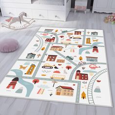 a child's play area with toys and rugs in the shape of a map