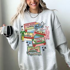 Christmas Movies Crewneck Sweatshirt, Holiday Sweater, Retro Xmas Sweatshirt, Festive Shirt, Vintage Cassette Tape Shirt, Graphic Tee Ideal for any situation, a unisex heavy blend crewneck sweatshirt is pure comfort. These garments are made from polyester and cotton. This combination helps designs come out looking fresh and beautiful. The collar is ribbed knit, so it retains its shape even after washing. There are no itchy side seams on these sweaters.  .: Made with a medium-heavy fabric blend o Christmas Clothing, Holiday Movie Night, Festival Shirts, Holiday Wardrobe, Holiday Sweater, Christmas Movies, Retro Inspired, Cut And Style, Christmas Shirts