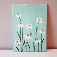 a painting of white daisies on a blue background