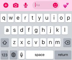 the keyboard is pink and white with some type of letters on it's side