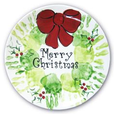 a merry christmas plate with a red bow on it