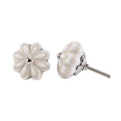 a pair of white ceramic flower knobs with screws on each side and an end