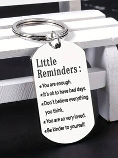 a keychain that says, little reminders you are enough it's ok to have bad days