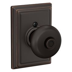 a black and brown light switch on a white background