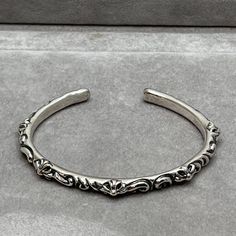 Great Looking And Modest Floral Cross Cuff Bangle Bracelet By Chrome Hearts Made With 925 Silver. Pre Owned But Has Been Recently Cleaned And Is In Near Perfect Condition. Chrome Heart Jewelry, Chrome Hearts Bracelet, Chrome Hearts Jewelry, Hearts Jewelry, Cheaper Than Therapy, System Of A Down, Cuff Bangle Bracelet, Floral Cross, Silver Bangle