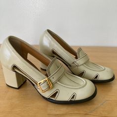 An original pair of 1960's beige coloured leather pump shoes. Label 'Cadet' Casuals.  Tough leather exterior with man made interior.  Loafer style front with a gold metal buckle feature.  Cut  features on sides and brown stitching details add a fine touch. Block heel.  Size is a 51/2B,  they are tiny, very narrow, and haven't been stretched. Please measure your feet before committing to buy. Or they are perfect for display for fashion history enthusiasts. In great condition. A couple of scuff ma Retro Closed Toe Heels For Work, Vintage Leather Shoes With Rubber Sole For Office, Vintage Closed Toe Court Shoes For Workwear, Vintage Leather Shoes With Leather Sole For Work, Vintage Leather Shoes For Work, Vintage Court Shoes With Leather Sole For Work, Vintage Court Shoes With Leather Sole For Office, Vintage Leather Shoes With Leather Sole For Office, Vintage Closed Toe Office Heels