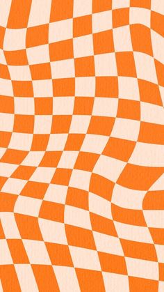 an orange and white checkerboard pattern is seen in this image, it appears to be made out of paper