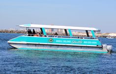 a blue and white tour boat in the water