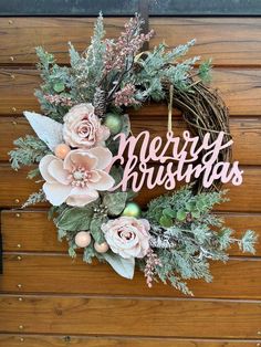 a wreath with the words merry christmas written on it