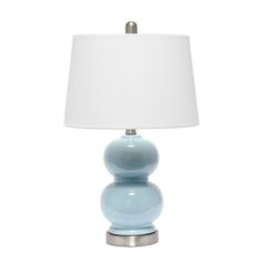 a blue lamp with a white shade on it