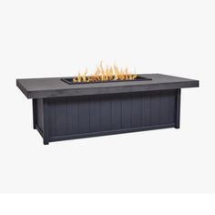 an outdoor fire pit with flames on the top and bottom, sitting in front of a white background