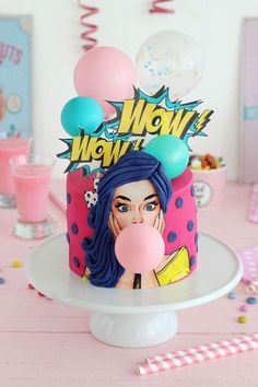 a birthday cake decorated with an image of a woman blowing a bubble on the top