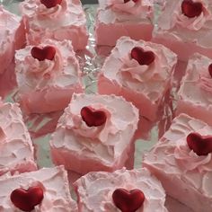 there are many pieces of cake that have hearts on them and frosted with icing