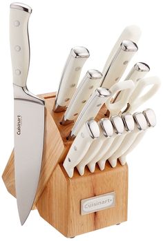 a knife holder with knives in it and a wooden block on the side that holds them