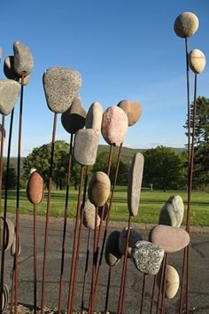 some very pretty rocks and metal poles by the road