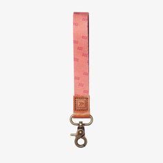 a pink strap with a metal hook on it