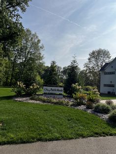 there is a sign in front of the house