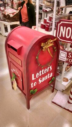 a red mailbox sitting in the middle of a store