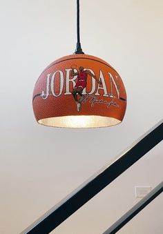 a basketball hanging from the ceiling in a room