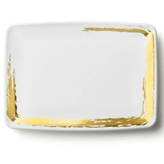 a white plate with yellow paint on it