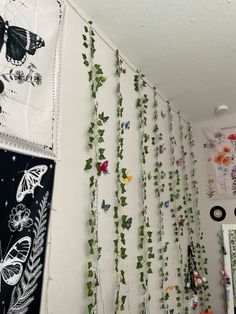 the wall is decorated with butterflies and vines