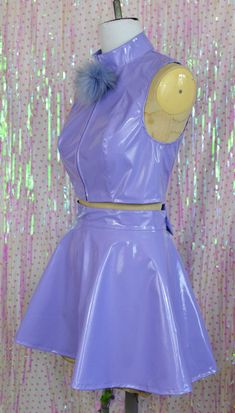 Glossy pastel cuteness! This crop top and skater skirt set is made from lilac pvc with removable pom-pom powder puff and bow details!! The top zips open all the way up the front to get into it, the skirt has a small zip in the back. Sizing is as follows: TOP XS - UK 8 - bust 33", bottom of ribs 27" S - UK 10 - bust 34", bottom of ribs 29" M - UK 12 - bust 36", bottom of ribs 31" L - UK 14 - bust 38", bottom of ribs 33" XL UK 16 - bust 40", bottom of ribs 35" There is a bit of stretch to the pvc Showgirl Outfit, Plastic Outfit, Vinyl Skirting, Plastic Clothes, Buy Buy, Top Cropped, Pastel Purple, Powder Puff, Complete Outfits