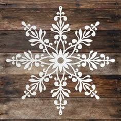 a snowflake cut out on top of a wooden table