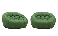 two green chairs sitting next to each other