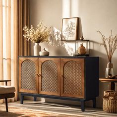 a living room with furniture and decor on the floor, including a sideboard that has wicker doors