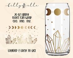 a glass jar with gold foil on it and the words hello fall written in black