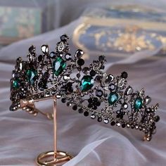 a tiara is displayed on a stand for $ 1 00