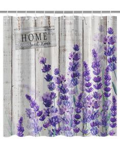 a shower curtain with lavender flowers on it