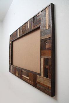 a wooden frame hanging on the wall