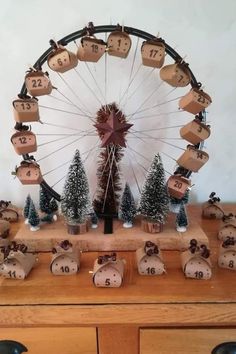 a wooden table topped with lots of decorations and a ferris wheel in the back ground